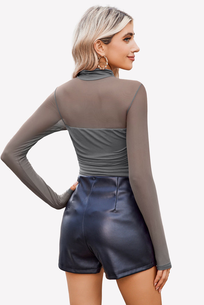 Grey mesh turtleneck bodysuit, ruched front, black shorts. Going out outfit.