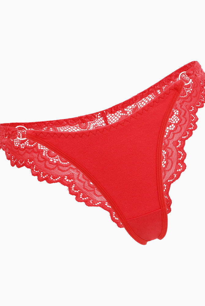 Red string panty with lace trim and ring detail. Low-rise cheeky design, sexy lingerie for women.