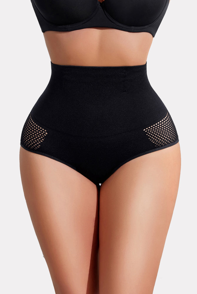 High-waisted black tummy control shapewear panty with mesh detail, creating a slimmer curve