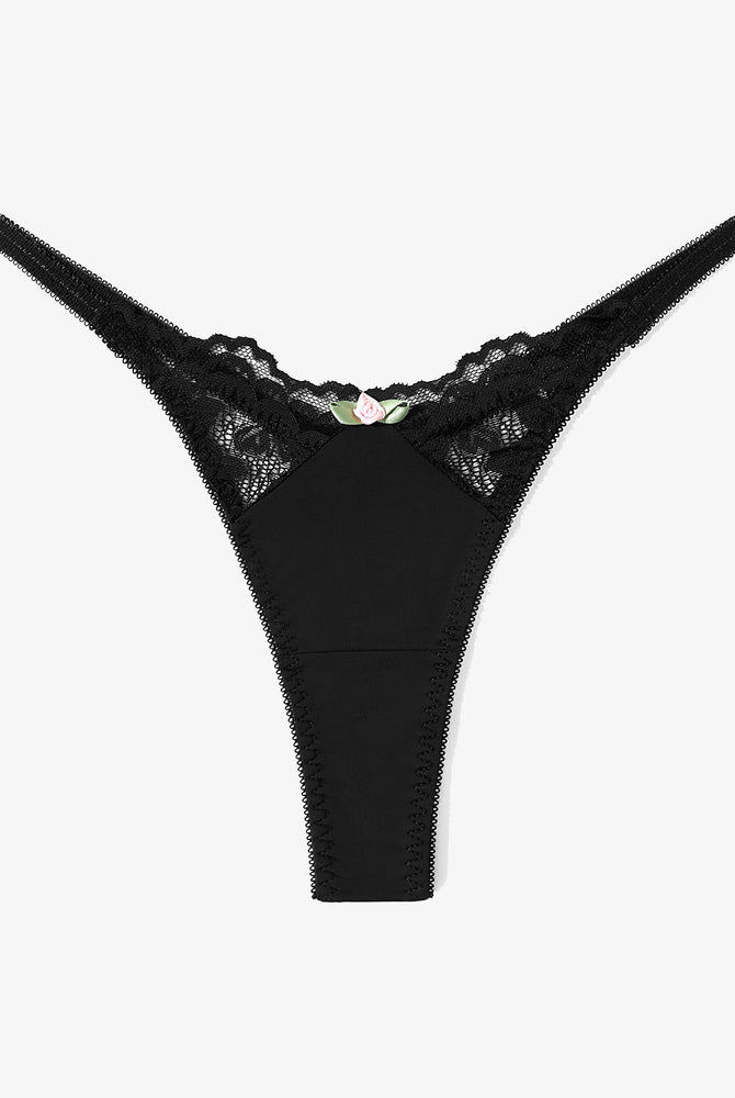 Black lace G-string thong. Sexy T-back panties with a delicate rose accent for a confident look.