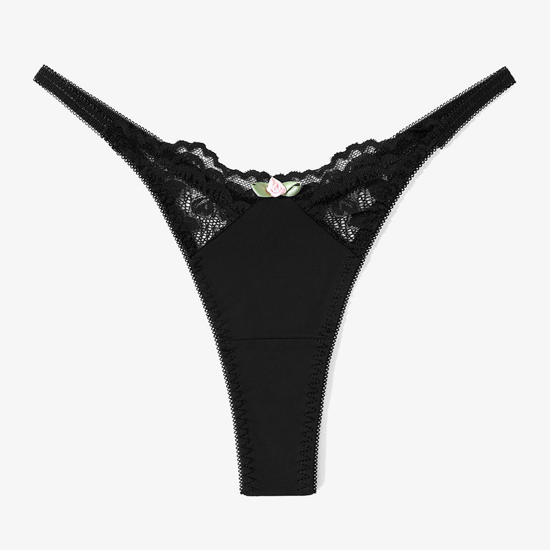Black lace G-string thong. Sexy T-back panties with a delicate rose accent for a confident look.