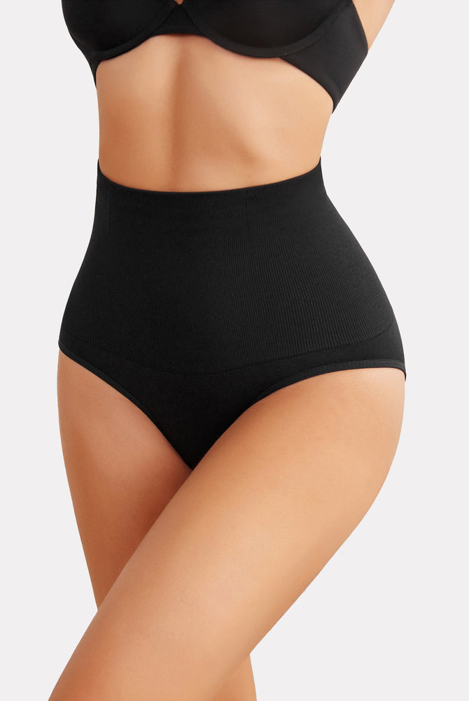 Black high-waisted tummy control thong shapewear, enhancing curves and offering a smooth silhouette.