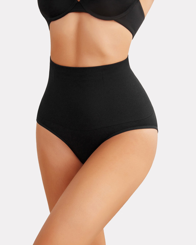 Black high-waisted tummy control thong shapewear, enhancing curves and offering a smooth silhouette.