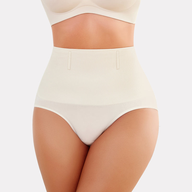 Beige high-waisted tummy control shapewear, enhancing curves and offering a smooth silhouette