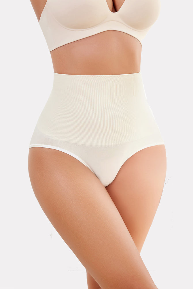 Beige high-waisted tummy control shapewear for enhanced curves and a smooth silhouette