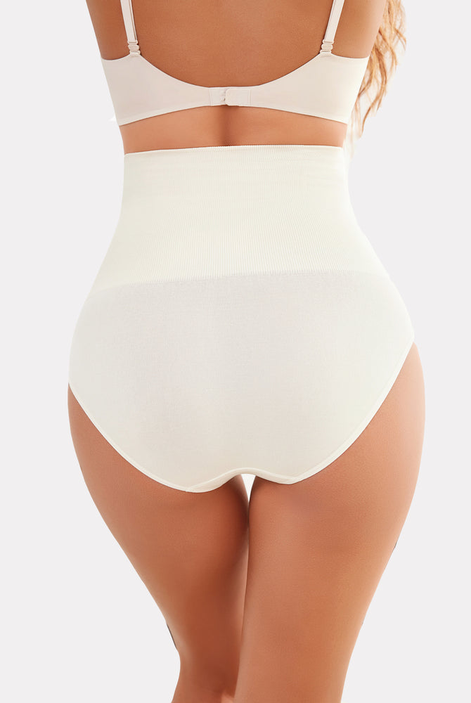 Beige high-waisted tummy control shapewear, smoothing the silhouette and enhancing curves
