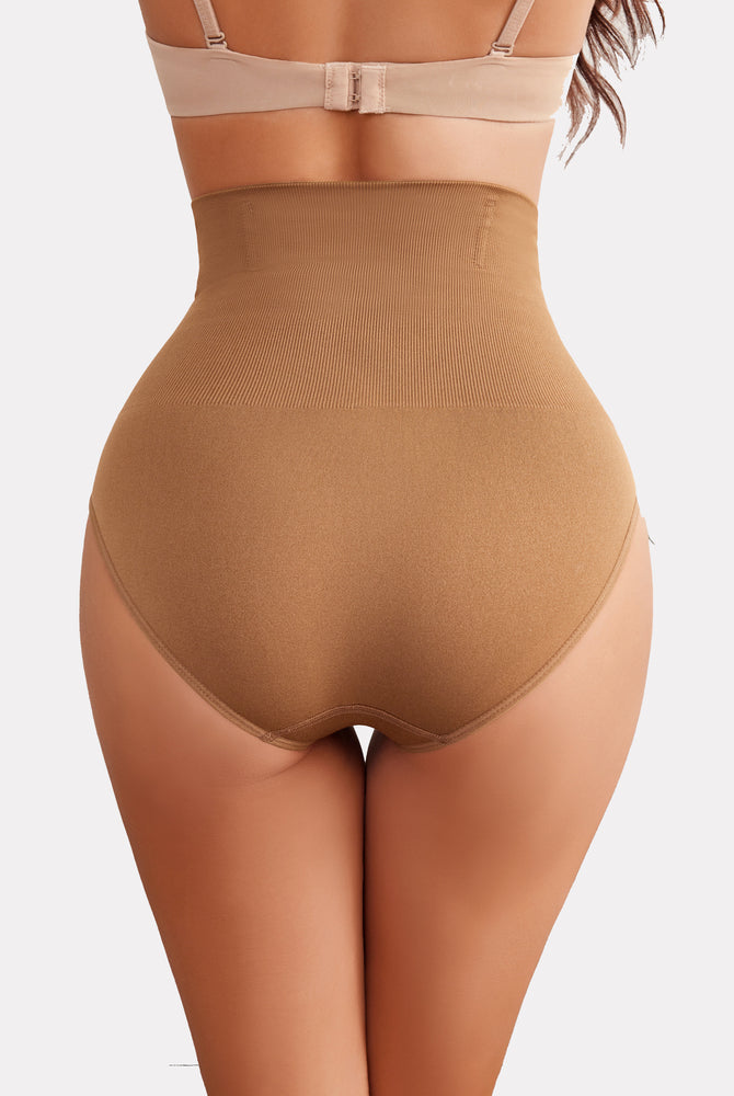 Tan high-waisted tummy control shapewear for enhanced curves and a smooth silhouette.