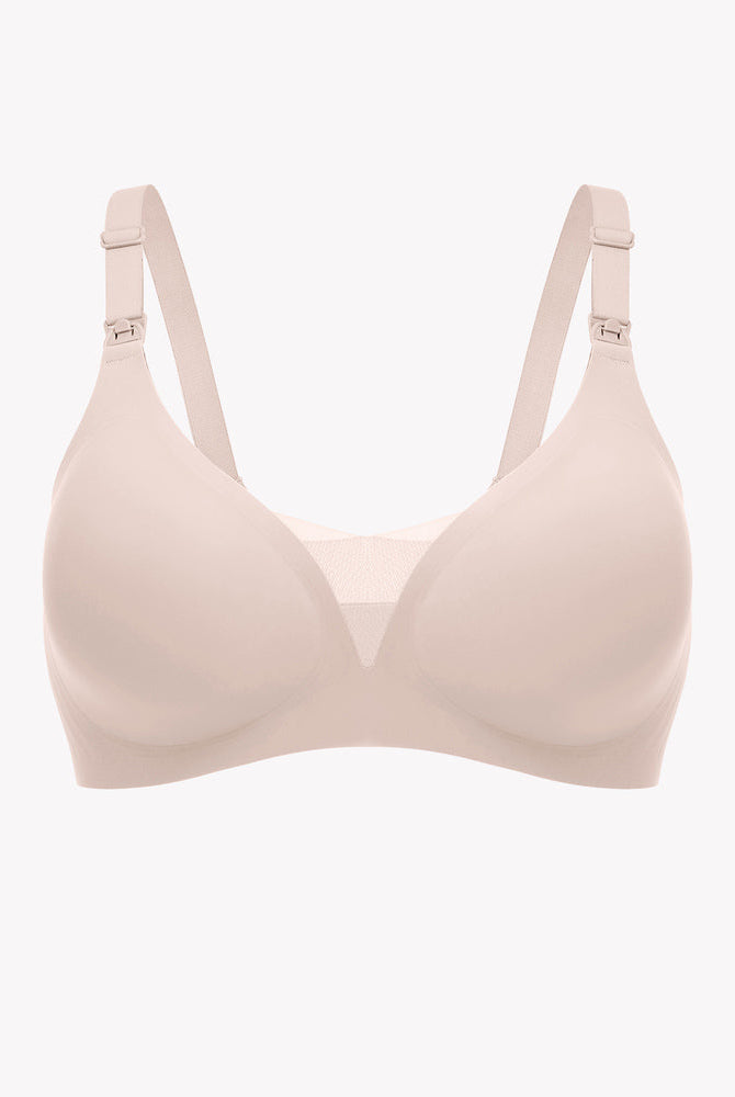 Beige wireless nursing bra with adjustable straps and breastfeeding access, soft and supportive.
