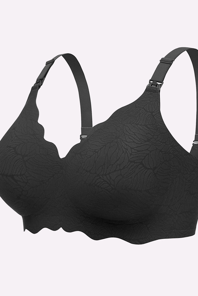 Black seamless nursing bra with floral pattern, adjustable straps, and nursing buckle