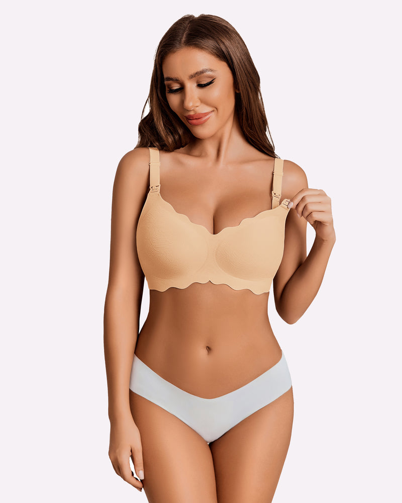 Beige seamless maternity nursing bra with adjustable straps and scalloped design.