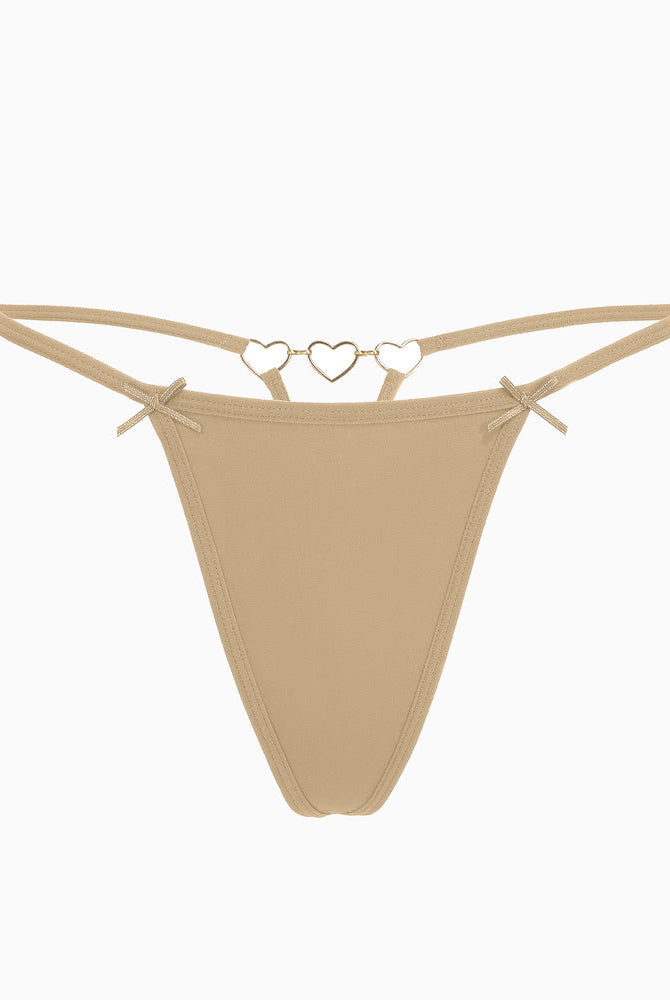 Beige G-string thong with gold heart ring detail and bows. Sexy and comfortable lingerie for women.