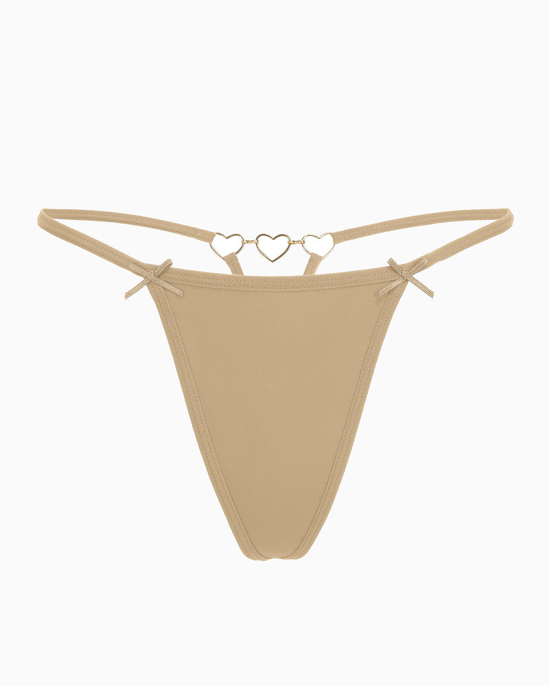 Beige G-string thong with gold heart ring detail and bows. Sexy and comfortable lingerie for women.