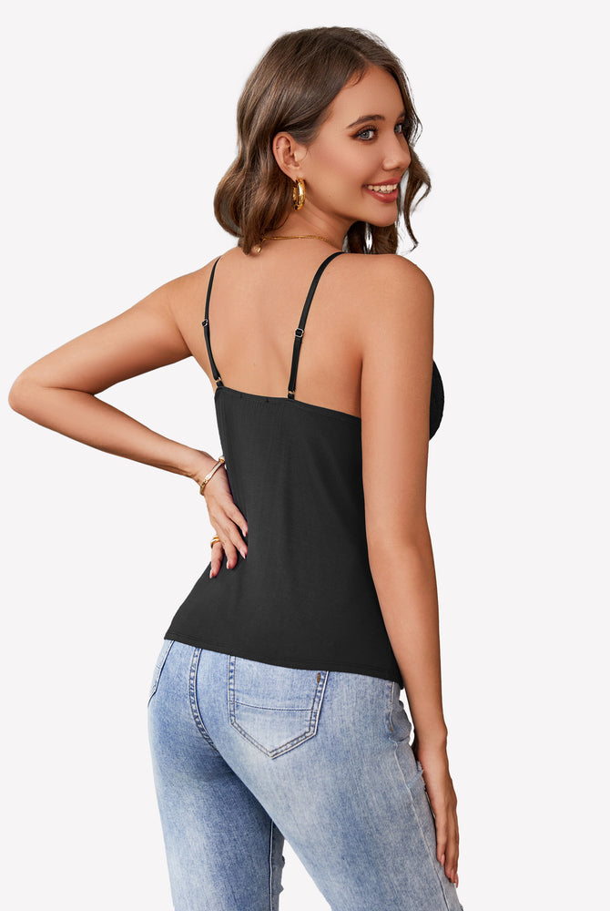 Black cami bralette with spaghetti straps, Y2k style, paired with jeans for a casual and chic look.