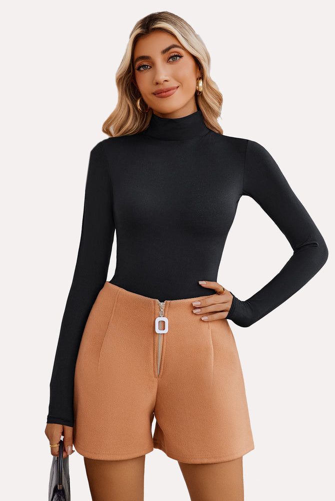 Black high-neck bodysuit shapewear, long sleeves, flattering fit, with tan high-waisted shorts.