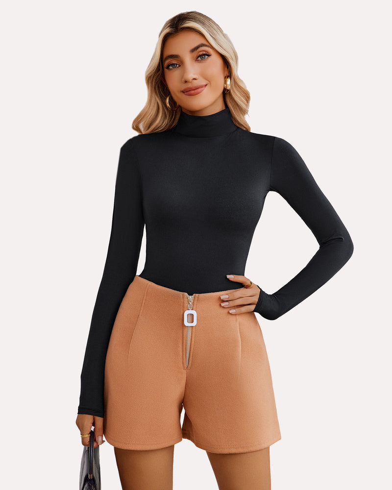 Black high-neck bodysuit shapewear, long sleeves, flattering fit, with tan high-waisted shorts.
