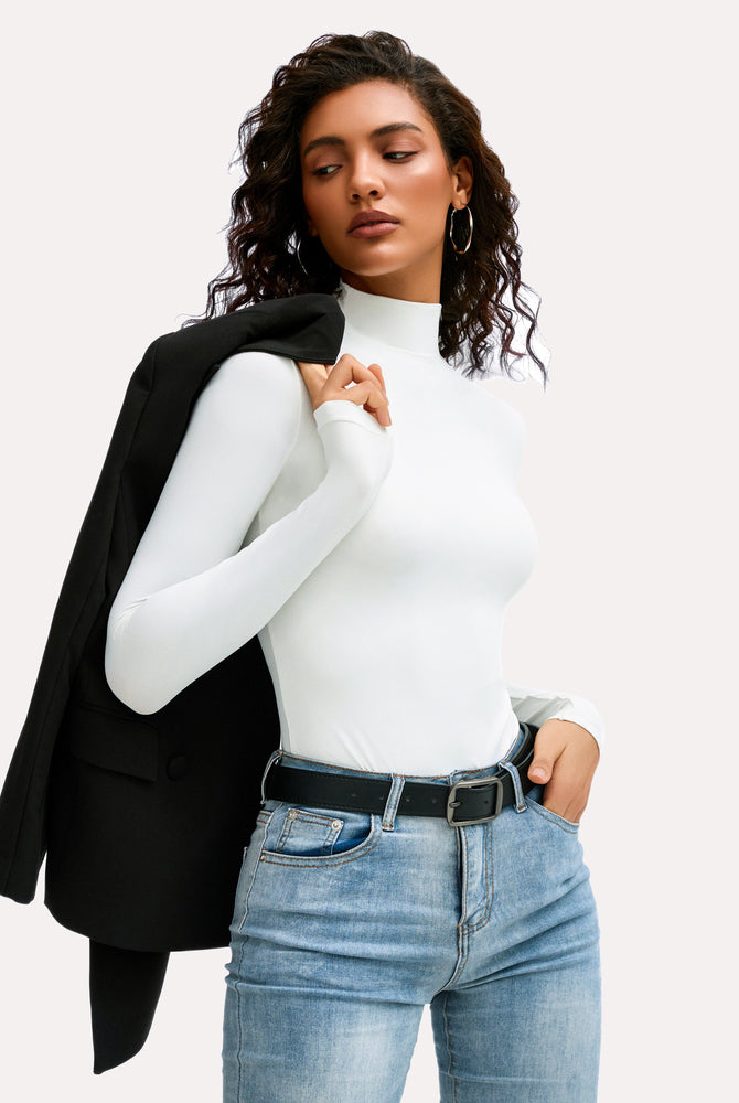 White high-neck bodysuit shapewear with jeans and a blazer. A stylish and versatile outfit.