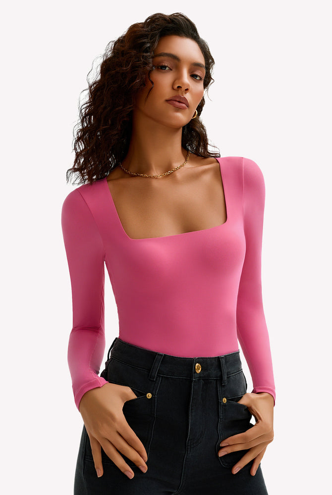 Fuchsia pink square neck long sleeve bodysuit, stretchy and form-fitting, shows bodyline