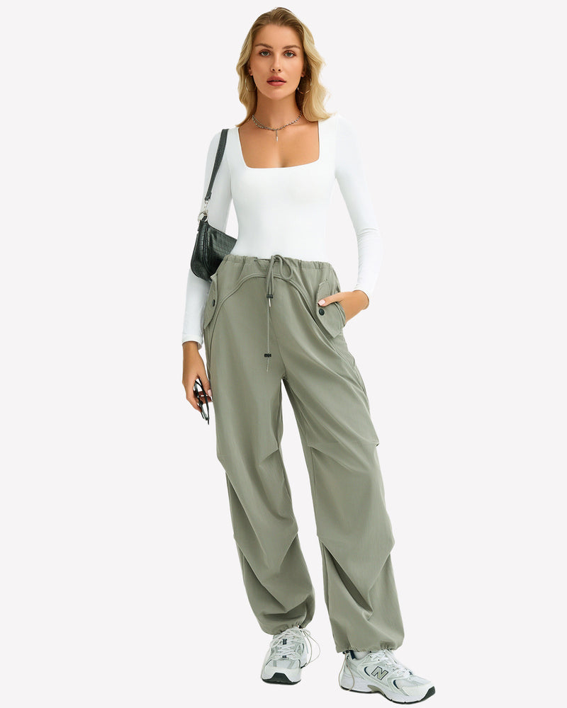 White square neck bodysuit paired with green cargo pants. Comfortable and form-fitting design.