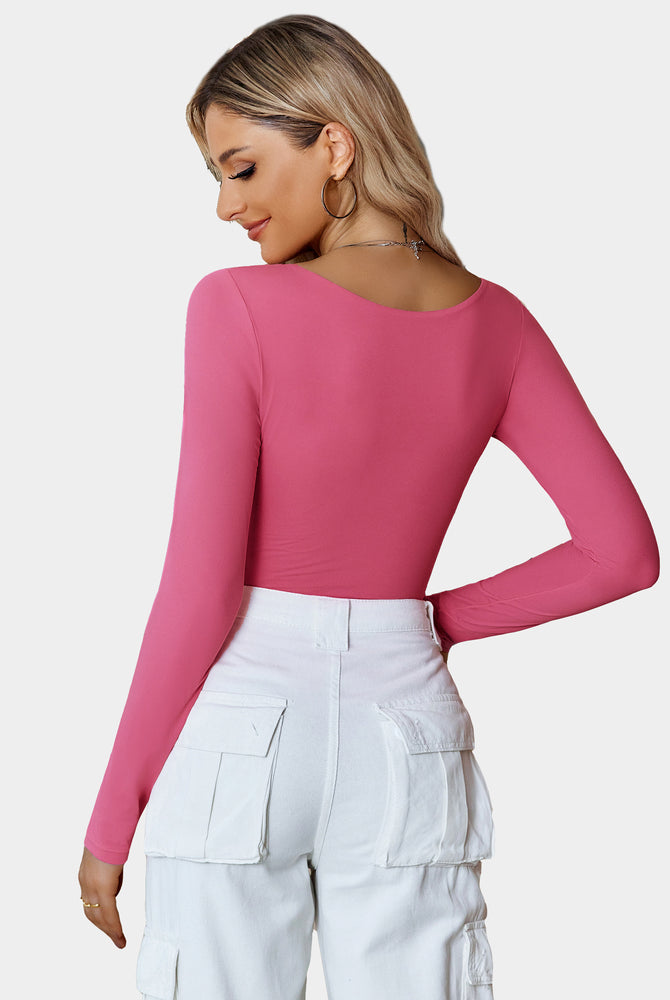 Pink scoop neck bodysuit, long sleeve, flattering fit, paired with white cargo pants, going out top