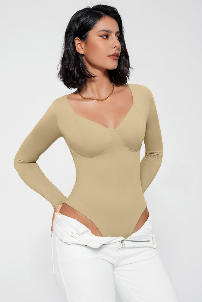 Beige long sleeve bodysuit with V-neck, creating a flattering silhouette, shapewear.