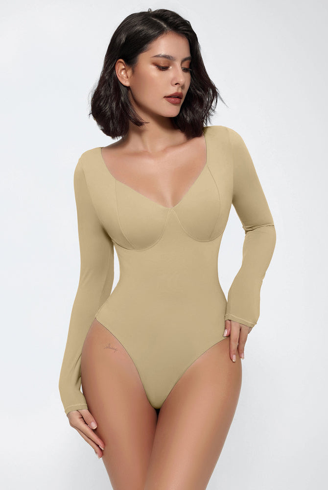 Beige long sleeve bodysuit shapewear with V-neck, tummy control, and a flattering silhouette.