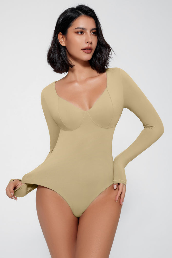 Tan long sleeve bodysuit shapewear with V-neck and tummy control, creating a flattering silhouette.