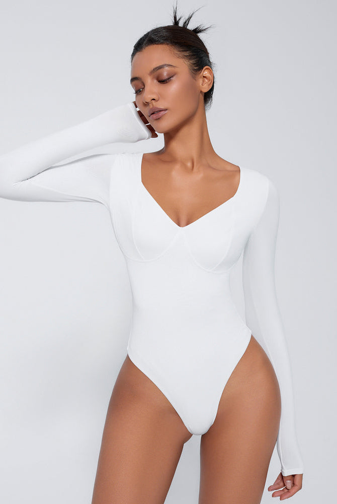 White long sleeve shapewear bodysuit with V-neck and tummy control for a flattering silhouette.