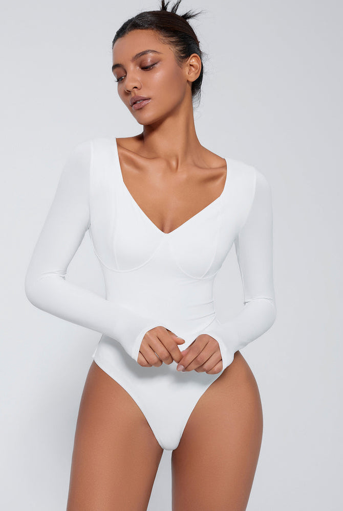 White long sleeve shapewear bodysuit with V-neck and tummy control for flattering silhouette.