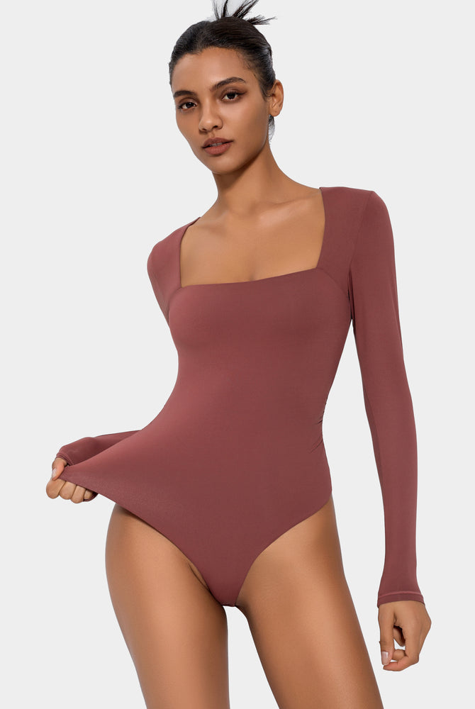 Terracotta square neck bodysuit with long sleeves. Elegant and flattering shapewear.