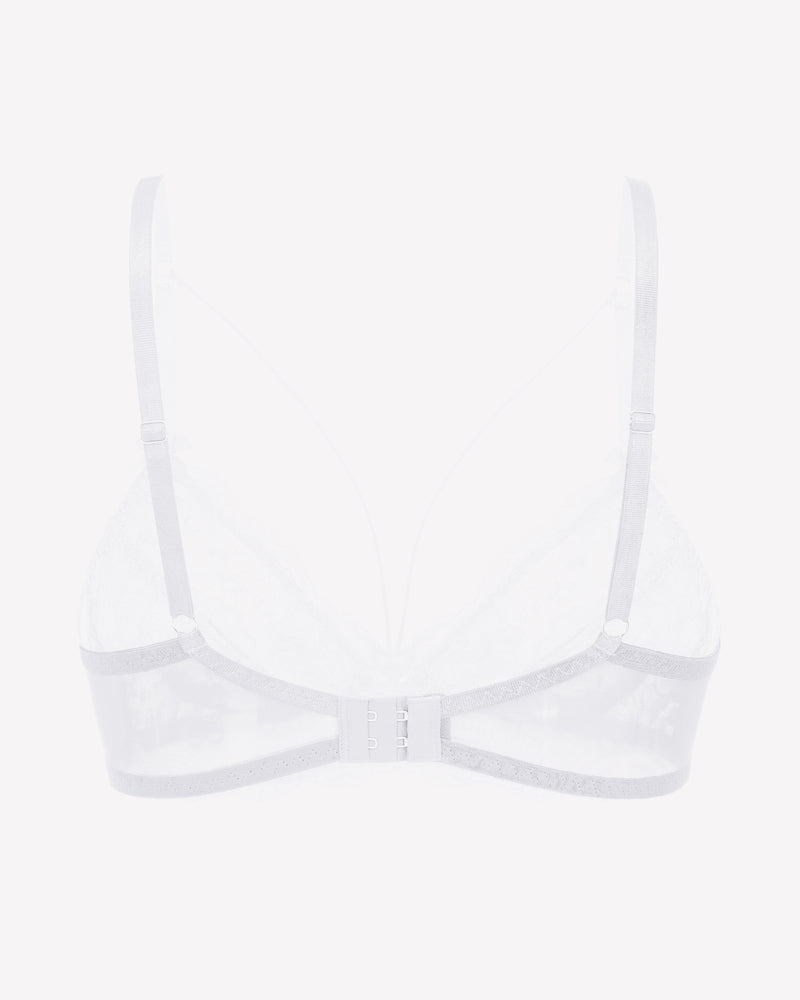 White lace unlined strappy bra with underwire support and adjustable straps. See-through design.