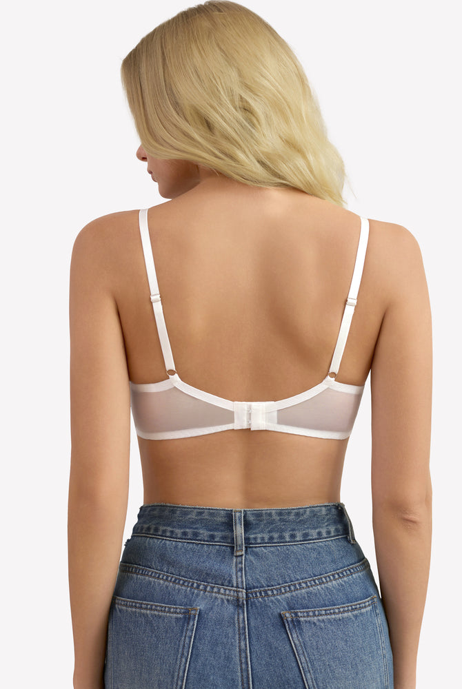 White unlined strappy bra with underwire support and see-through design. Sexy lingerie for women.