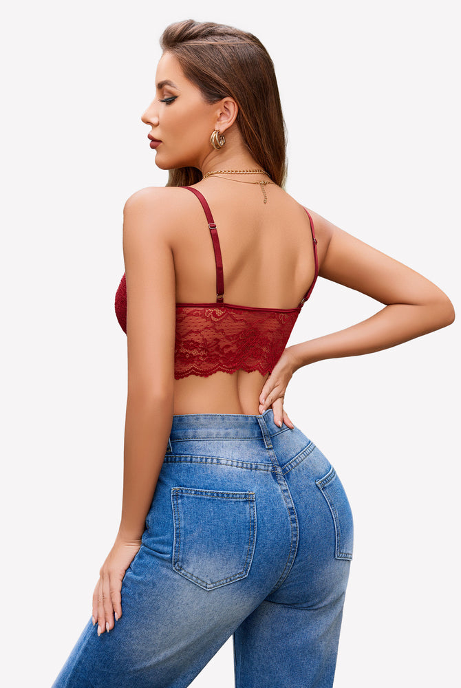 Red floral lace bustier crop top with adjustable straps, denim jeans. Sexy lingerie.