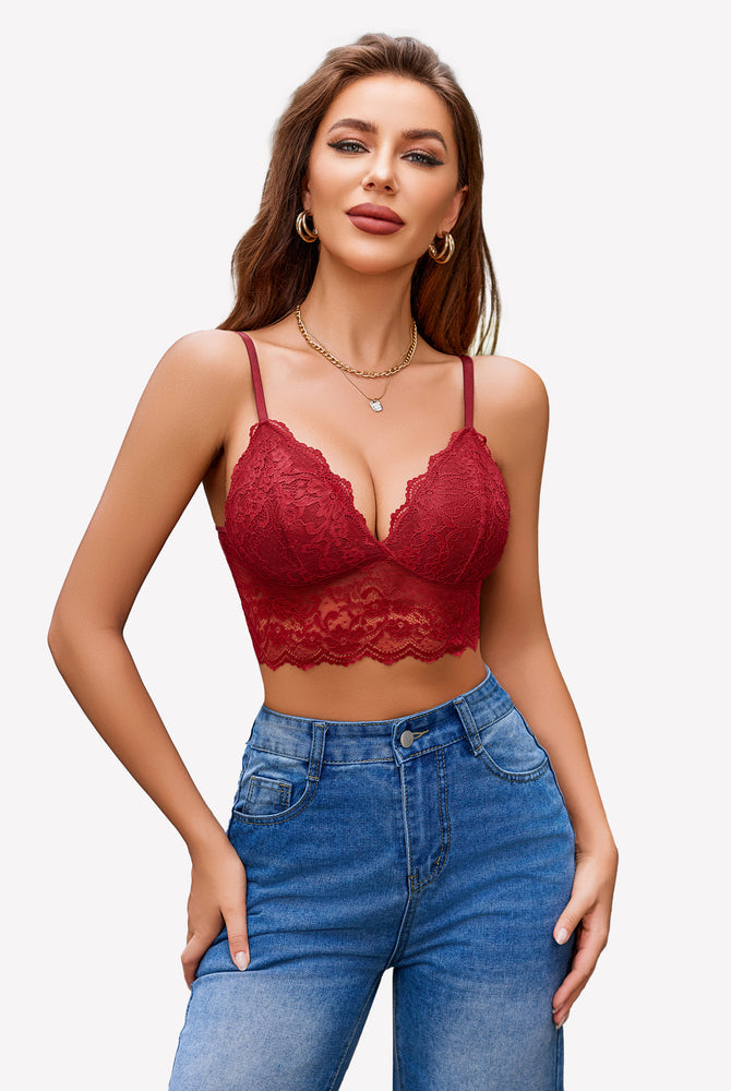 Burgundy red floral lace bustier crop top with adjustable spaghetti straps, paired with denim jeans.