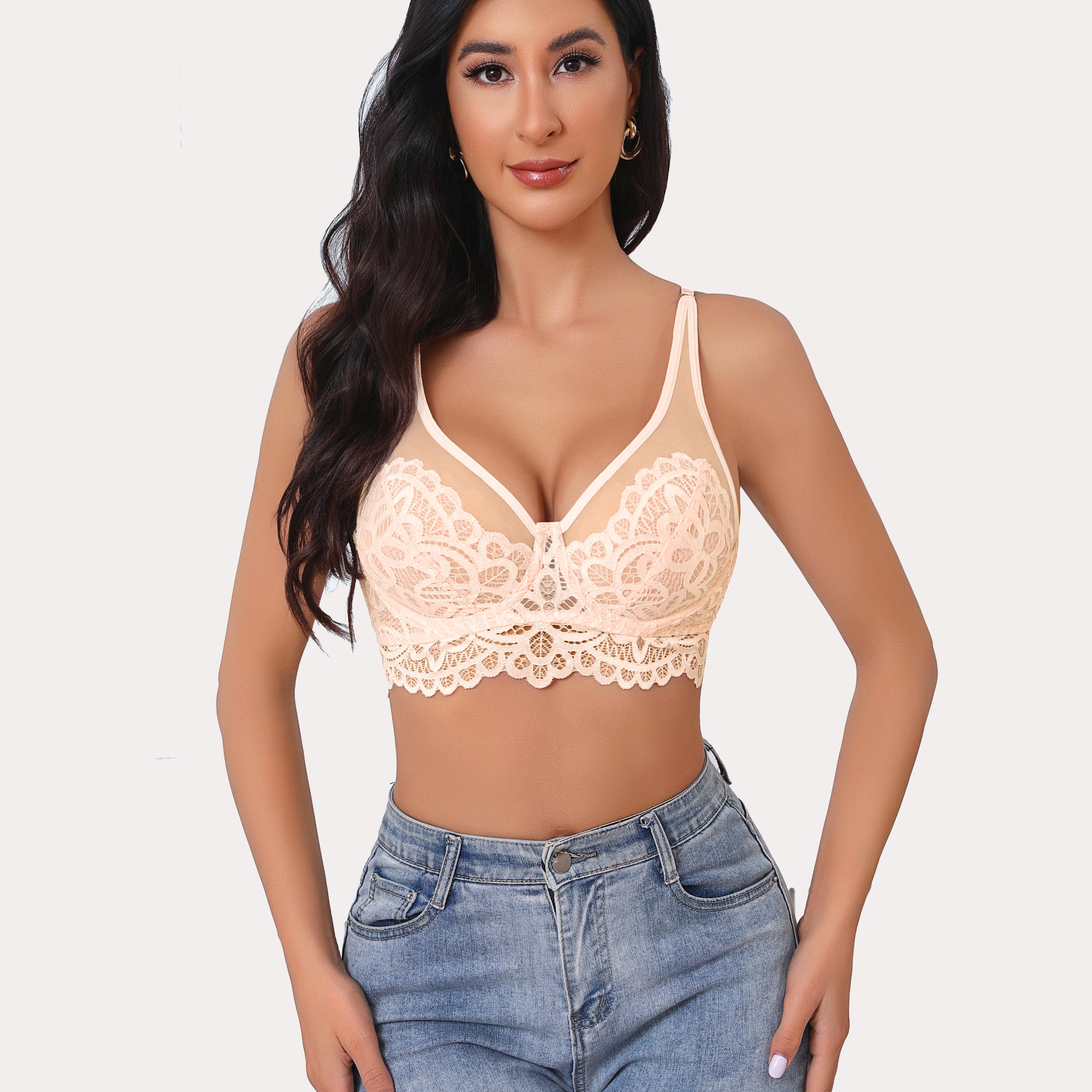 Peach lace bralette with adjustable straps and floral design, paired with jeans. Full coverage bra.