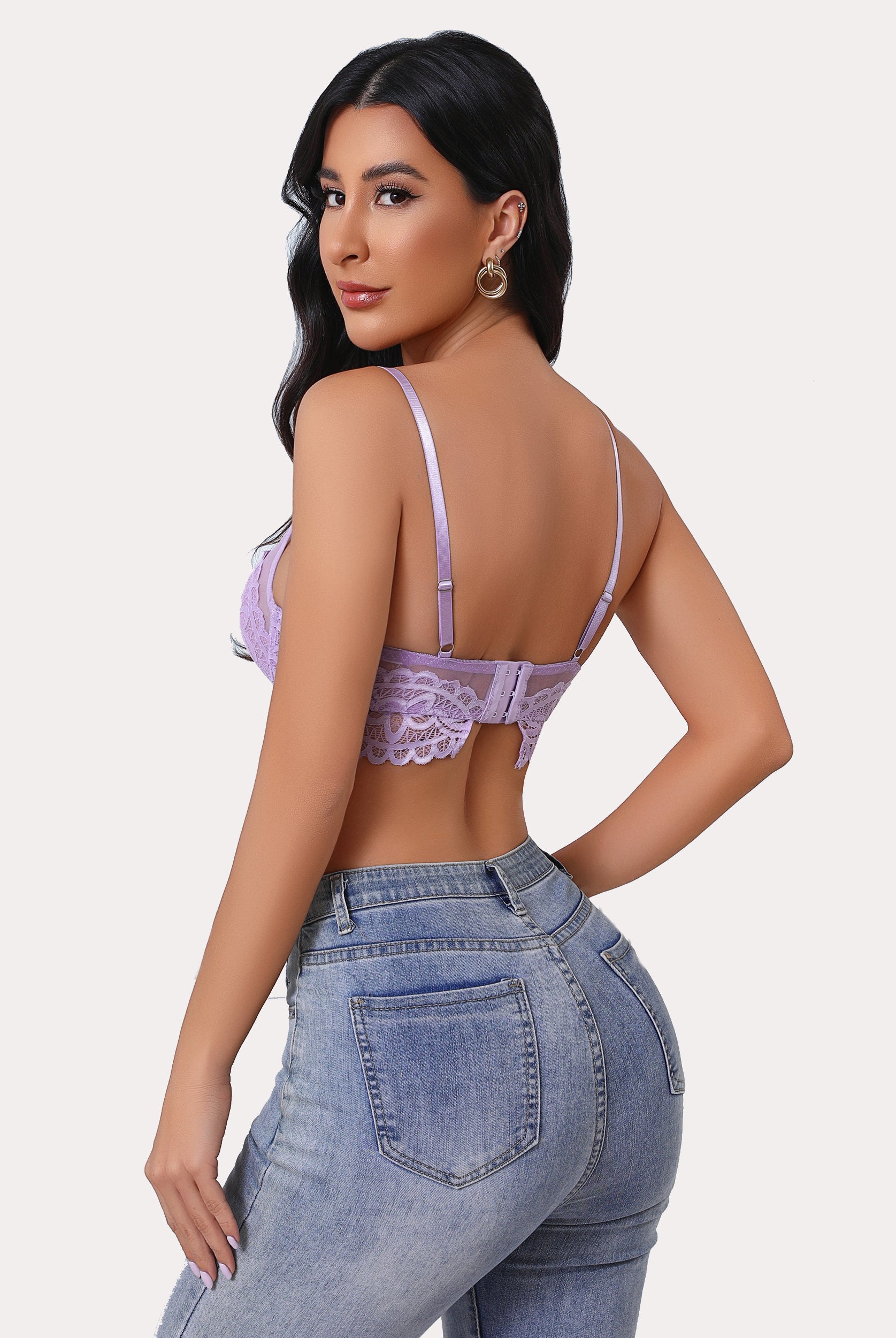Lavender lace bralette with adjustable straps, U-shaped back, and jeans. Sexy lingerie.