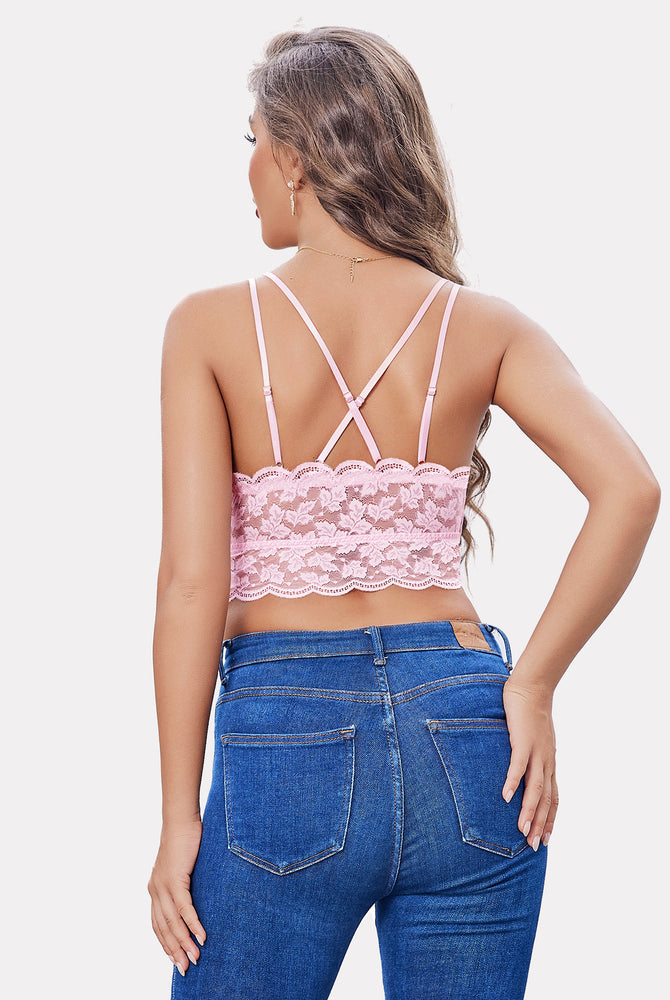 Pink lace crop top with adjustable straps, racerback design, paired with jeans; Y2K fashion