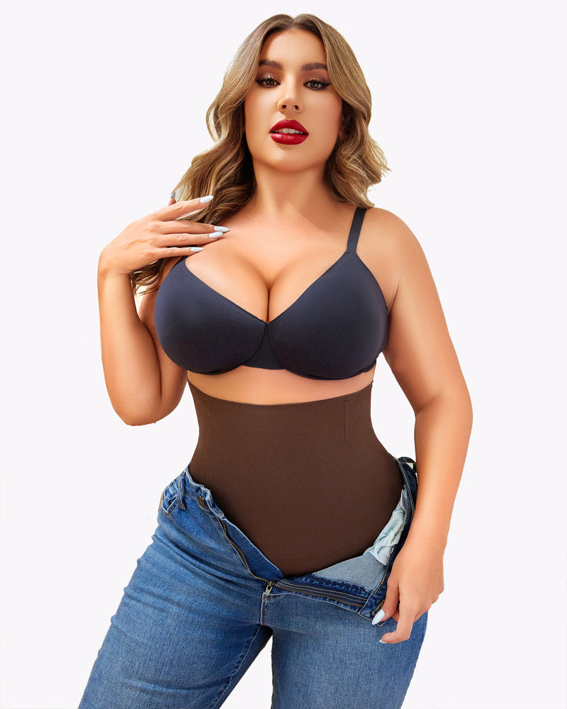 Brown tummy control shapewear with black bra and jeans, showcasing a smooth silhouette.