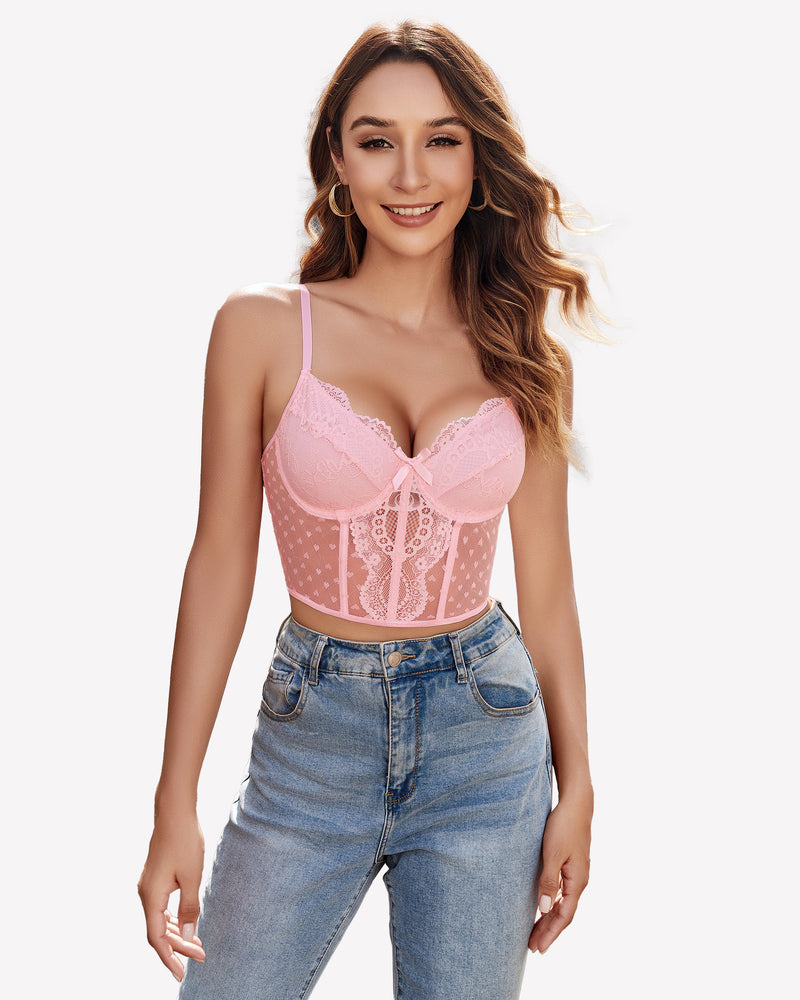 Pink lace corset top with underwire, polka dot mesh, and adjustable straps, paired with blue jeans