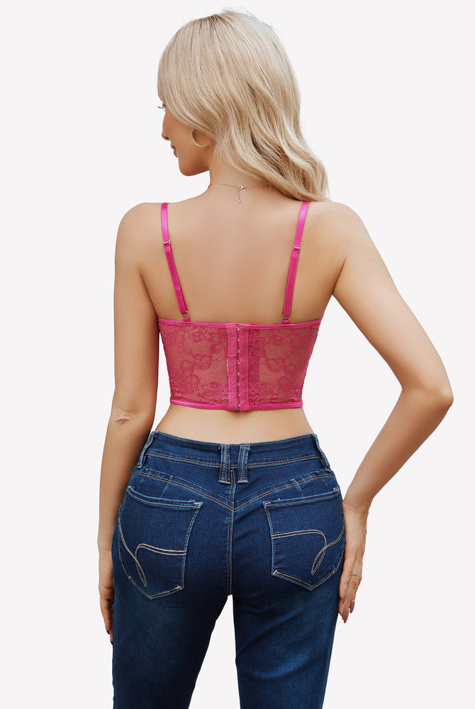 Pink lace corset top with adjustable straps, paired with blue jeans, floral lace design