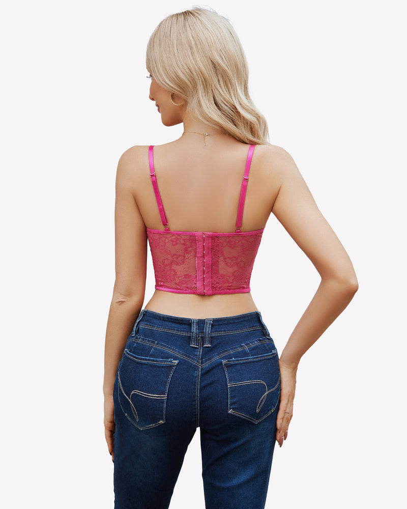 Pink lace corset top with adjustable straps, paired with blue jeans, floral lace design