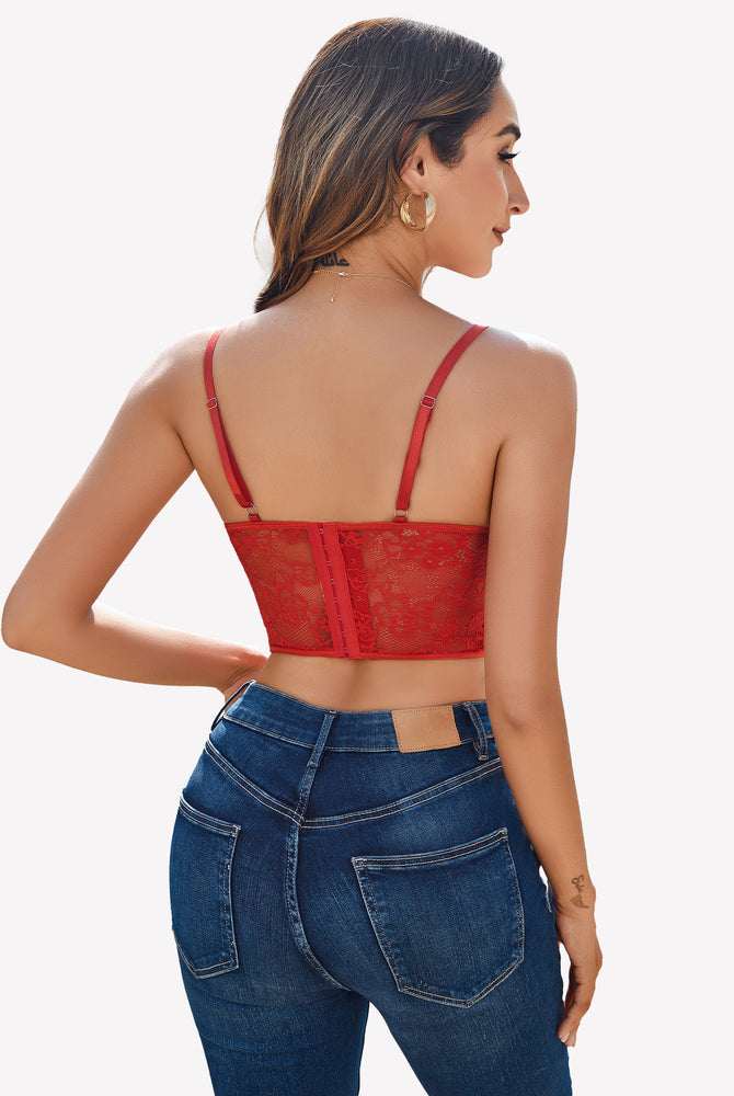 Red lace corset top with adjustable straps and blue jeans, floral lace design