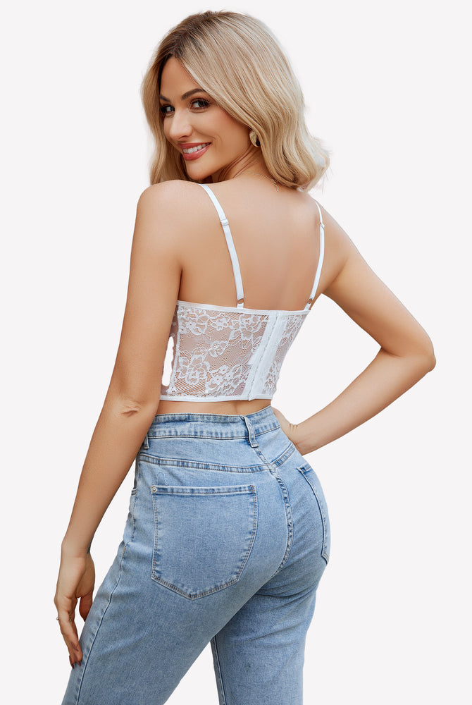 White lace corset top with adjustable straps, paired with blue jeans. Sexy lingerie.