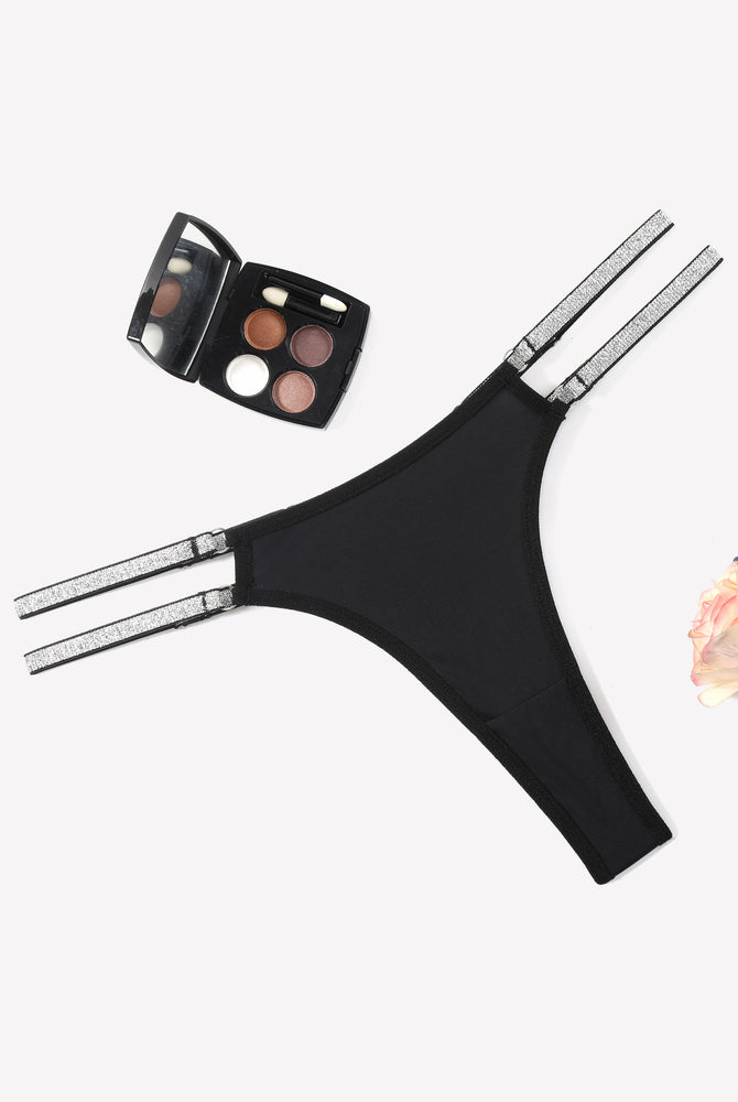 Black low waist Brazilian tanga panties with flashing straps and makeup, sexy lingerie