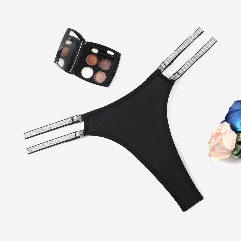 Black low waist Brazilian tanga panties with flashing straps and makeup, sexy lingerie