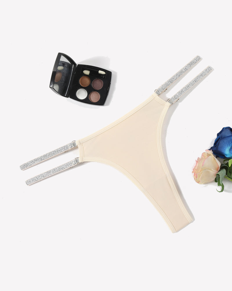 Beige low waist Brazilian tanga panties with flashing strap details. Sexy lingerie for women.