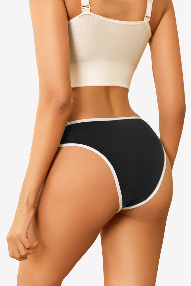 Black cotton hipster panty with white trim, low rise design, paired with a beige crop top.