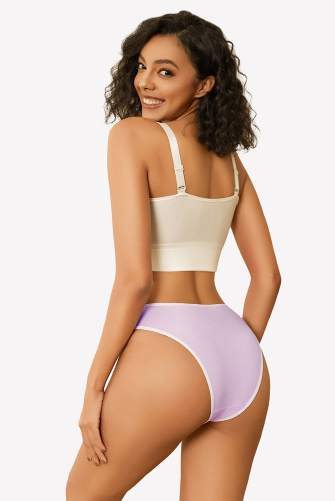 Purple cotton hipster panties with white trim, low rise, paired with white bra, smiling woman