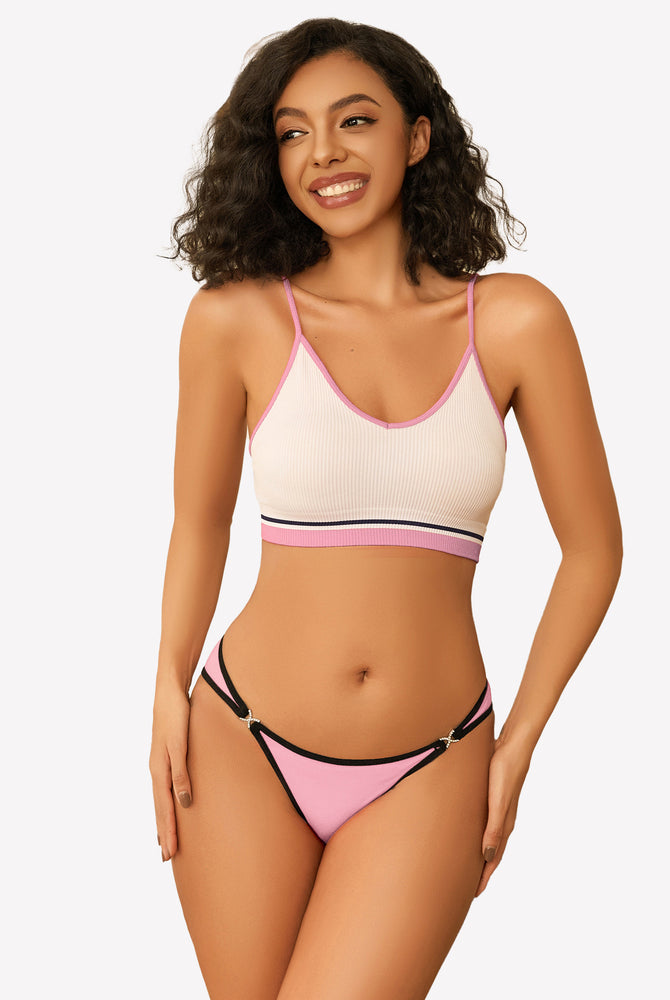 Pink low rise thong panty with rhinestone accents, white and pink trim bra, smiling woman
