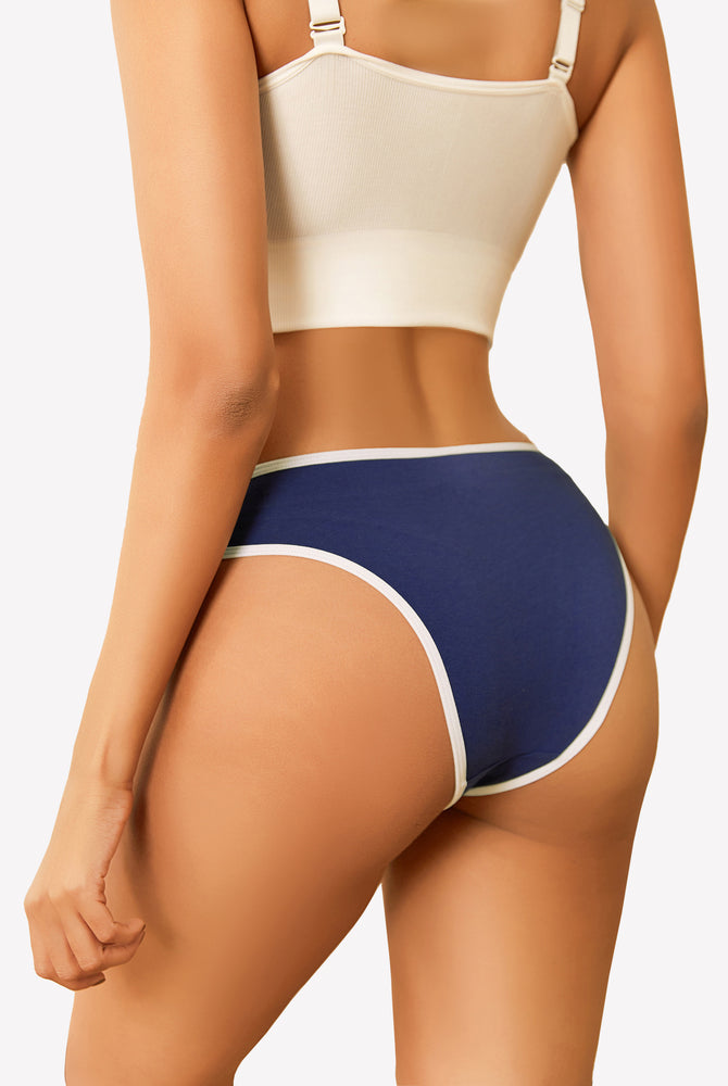 Navy blue cotton hipster panty with white trim, low rise design, paired with a white bra.
