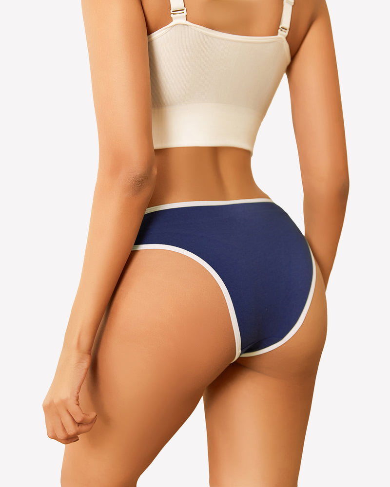 Navy blue cotton hipster panty with white trim, low rise design, paired with a white bra.